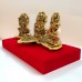 Oxidized Gold Plated Laxmi Ganesh Saraswati with Diya Mounted on Red Velvet Platform